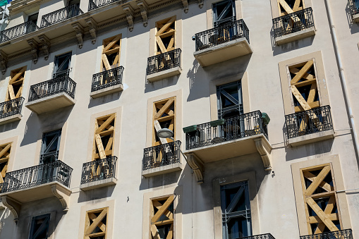 Nice, France - April 25, 2023: The facade of the building, whose windows have been protected with special elements during the ongoing renovation work.