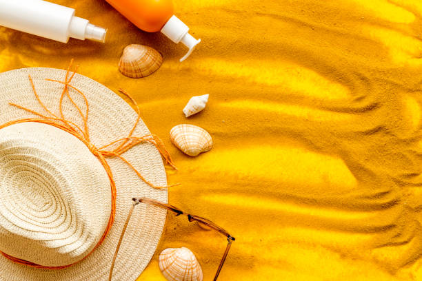 istock Beach accessoties with sunscreen cosmetic and straw hat. Summer beach concept flatlay 1693832546