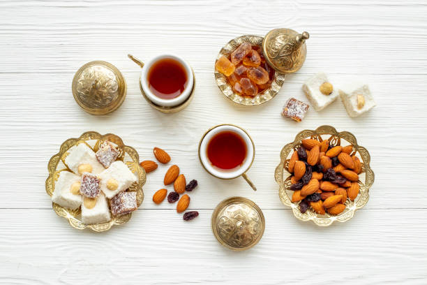 istock Arab style tea table with tea and sweets. Muslim holiday background 1693853786