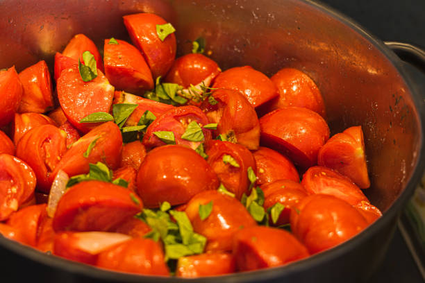 istock preparation for a tomato coulis, with basil leaves 1693857113