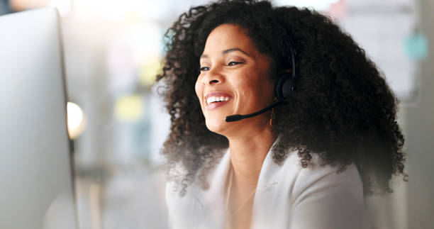 istock Happy female customer service agent smiling while working in a call centre, talking to a client with a headset. A helpful saleswoman assisting customers with purchase orders and questions online 1693885133