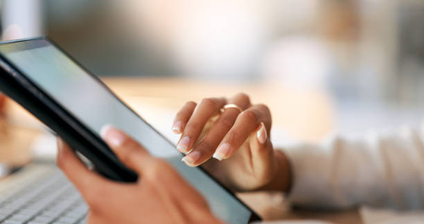 istock Interior designer scrolling on digital tablet, planning and choosing variety of decoration designs for a new property on real estate market. Closeup of decorator searching through ideas on technology 1693885178