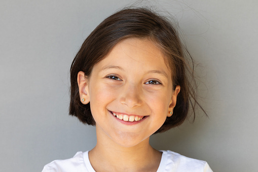 Close-up portrait of girl smiling.