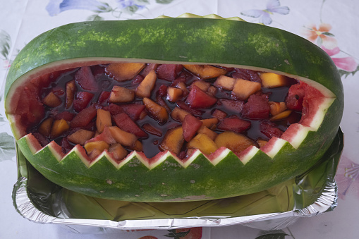 fruit salad presented in a watermelon without the pulp