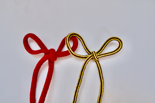 Red Shoelace with Yellow Shoelace together
