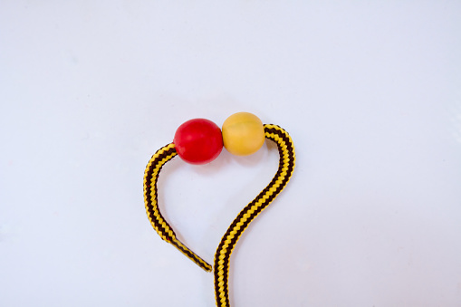 Yellow and Red beads tied together background