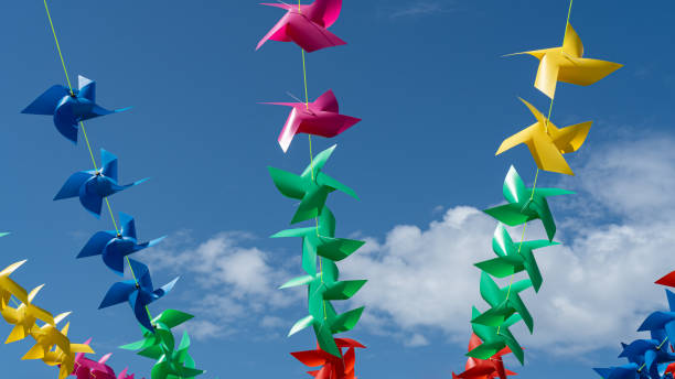 istock Colorful windmills arranged on slings are used as decorations on celebration days. 1693951759