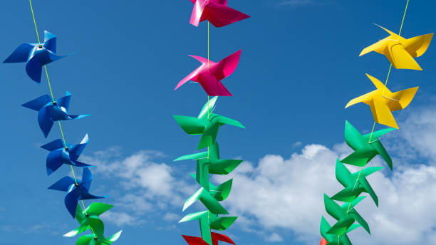 istock Colorful windmills arranged on slings are used as decorations on celebration days. 1693951763