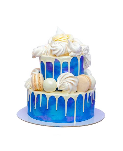 istock Two layered birthday cake with blue frosting and chocolate decorations isolated on white background, copy space, png 1693980362