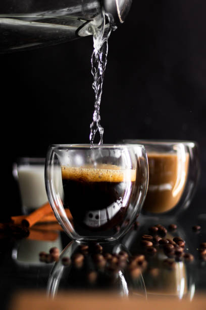 istock Coffee in a glass, on a black background, from coffee beans. Morning 1693996680