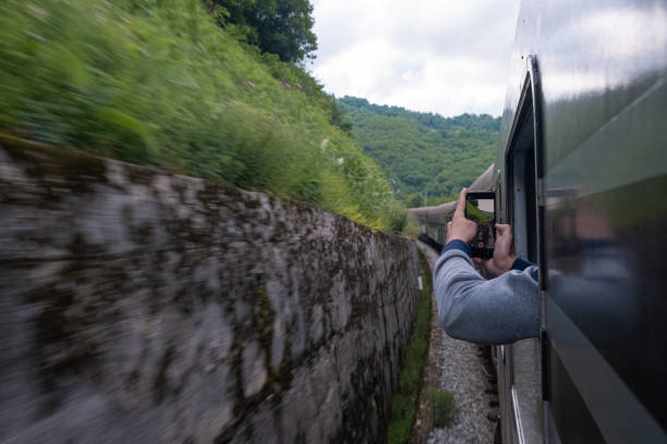 Photographer taking picture of train rails | Free Stock Image - Barnimages
