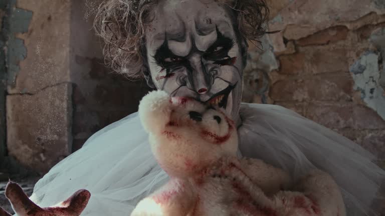 Scary Clown Kissing and Then Biting Teddy Bear in Blood Spots