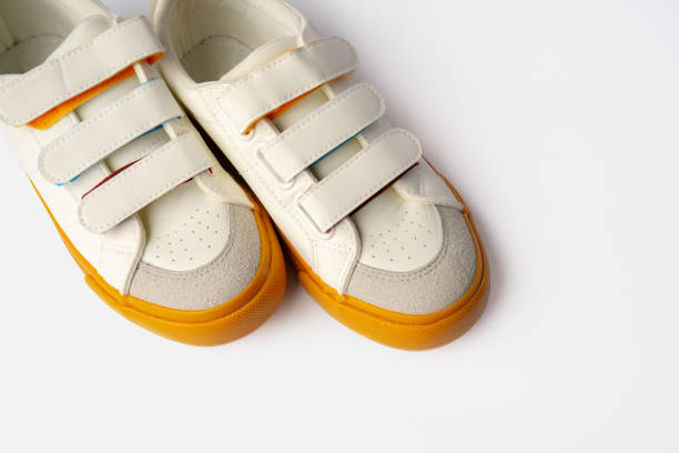 istock Pair of new sneakers isolated on white background 1694054822