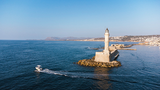 Old lighthouse building at Chania, Greece. Famous travel tourism landmark. Aerial top down drone view