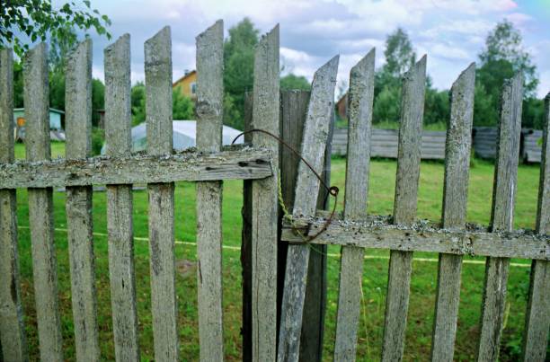 istock fence in the village 1694058252