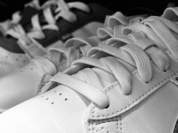 istock White trainer shoes and laces 1694060413