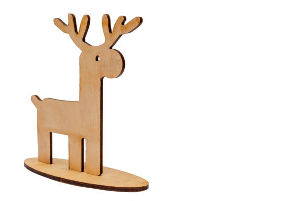 istock Close-up small wooden reindeer (deer) isolated on white background 1694063665