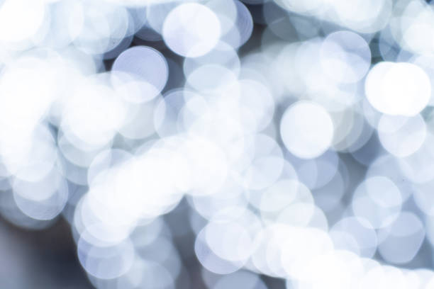 istock Elegant and romantic white Christmas lights background with bokeh 1694067569