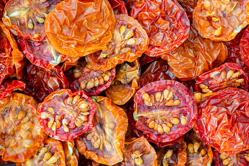 Pile of red and orange dried cherry tomatoes