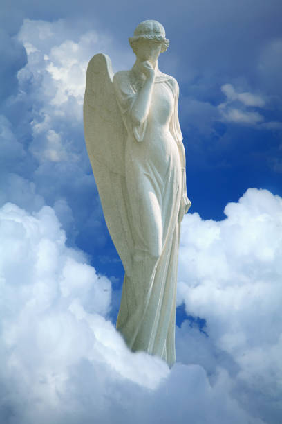 istock Angel of heaven against sky background. Vertical image. 1694084648
