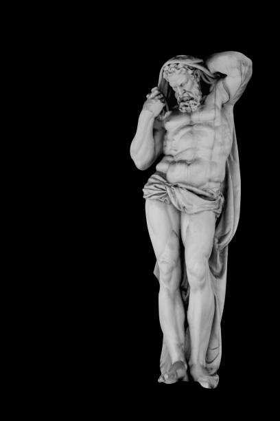 istock Ancient statue of Hercules (Heracles). An ancient statue isolated on black background. 1694086840