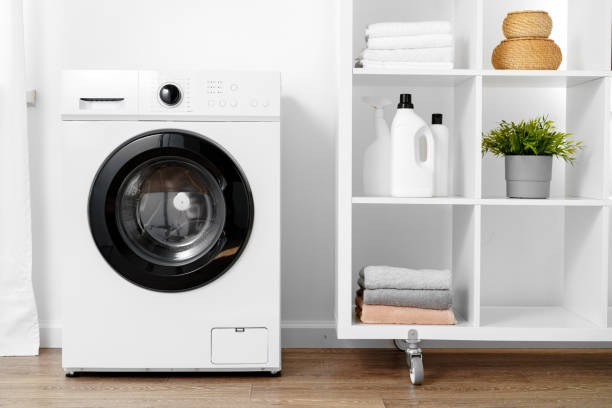 istock Close up of washing machine in a laundry room 1694087384