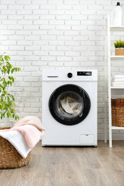 istock Modern white washing machine close up photo 1694093556