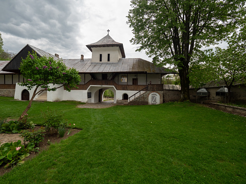 Crasna, Romania - May 11 2023: The church of Crasna Hermitage in Gorj County. It was first mentioned at 1486.