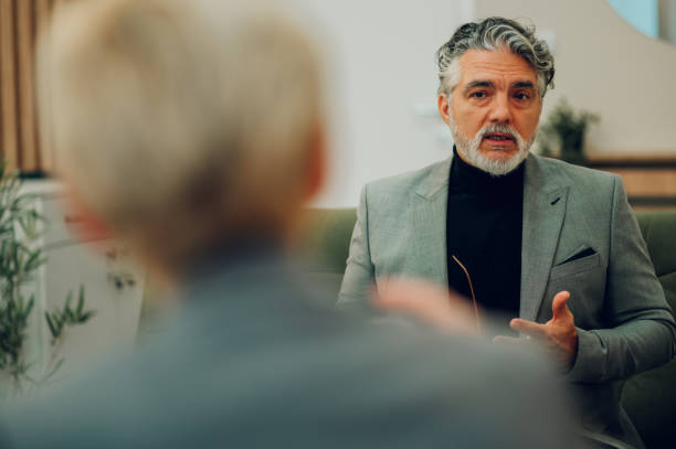 istock A senior male client is discussing issues with a psychotherapist in a session. 1694103185