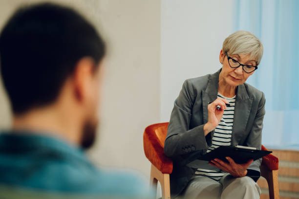istock Psychotherapist is sitting in the office during the session with a patient 1694103749