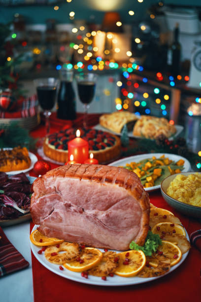 istock Christmas Dinner with Baked Glazed Ham with Mashed Potatoes, Green Beans, Radicchio Salad and Berry Pie 1694111747