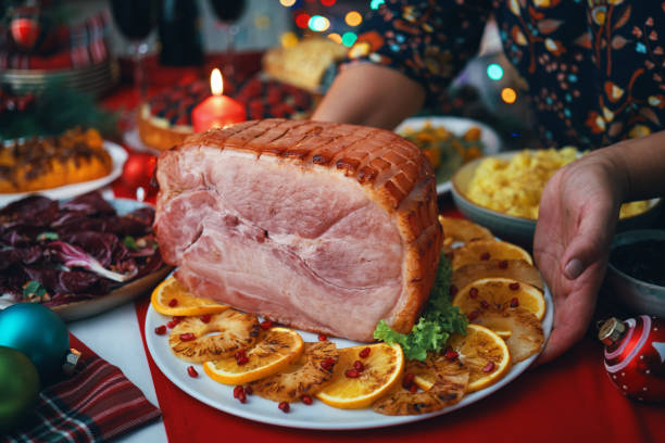 istock Christmas Dinner with Baked Glazed Ham with Mashed Potatoes, Green Beans, Radicchio Salad and Berry Pie 1694111759