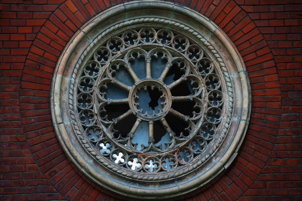Background of round ancient destroyed window with glass.