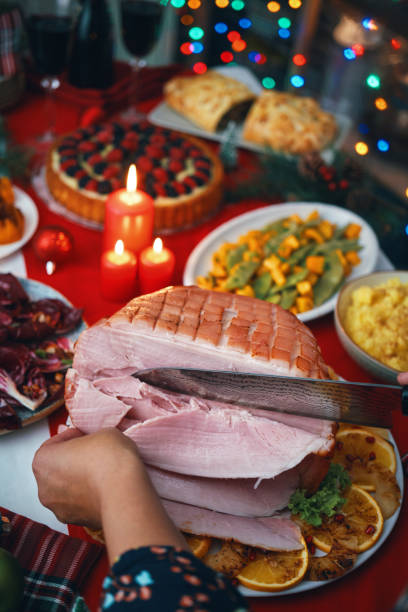 istock Christmas Dinner with Baked Glazed Ham with Mashed Potatoes, Green Beans, Radicchio Salad and Berry Pie 1694112304