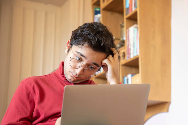 istock Young man worried while shopping on laptop 1694115578