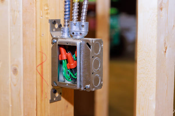 istock Electrical metal box wiring inside interior walls of under construction house 1694120759