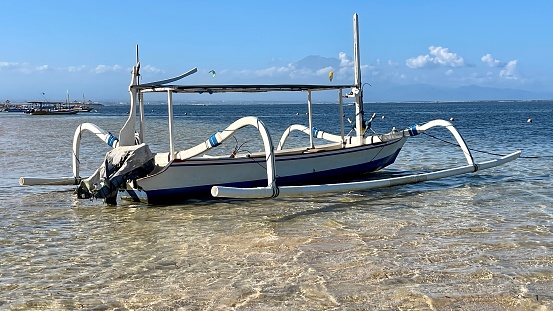 An old, abandoned boat on Bounty Island's beach, Fiji.