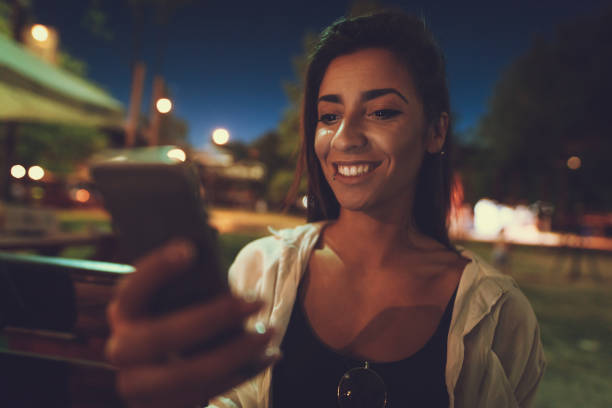 istock Girl Using Social Media On The Beach 1694129169