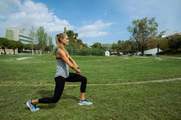 istock Young woman exercising in the park 1694129687