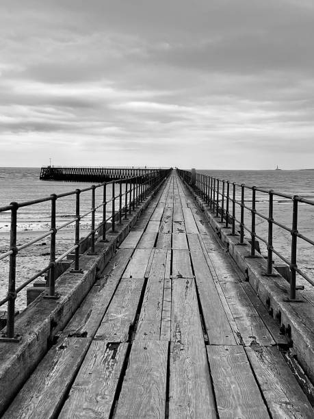 istock Diminishing perspective on a wooden pier at Blyth 1694141042