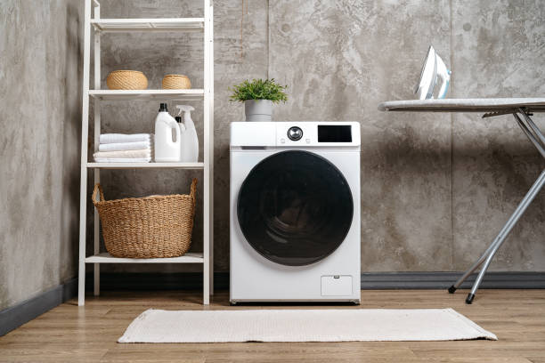 istock Washing machine in a gray modern laundry room 1694142207