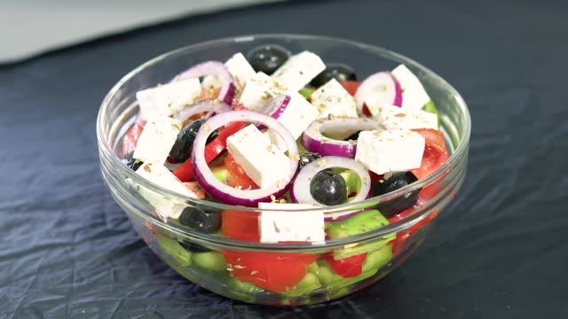 A large bowl with Shopsky salad of vegetables and cheese. stock video