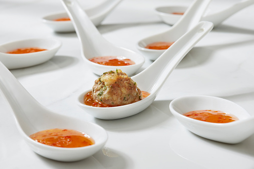 Platting Asian Inspired Pork and Shrimp Meatballs with  Sweet Chili Sauce Dip