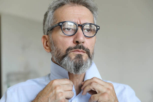 sexy man with glasses and jacket on shoulder white shirt tie business finance. High quality photo
