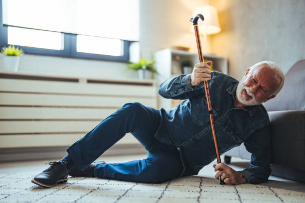 istock Senior Man Fallen On Carpet With Walking Stick 1694167600
