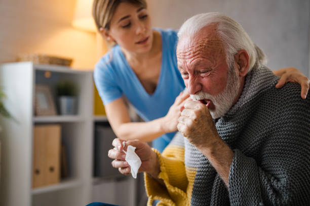 istock Doctor consoling senior patient at home. 1694168571