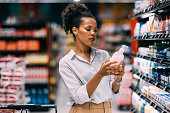 A Serious Beautiful Cuban Woman Shopping At The Supermarket