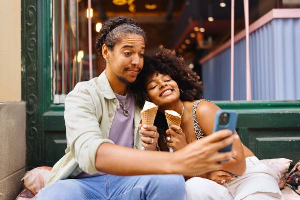 istock Man and woman taking a selfie 1694200539