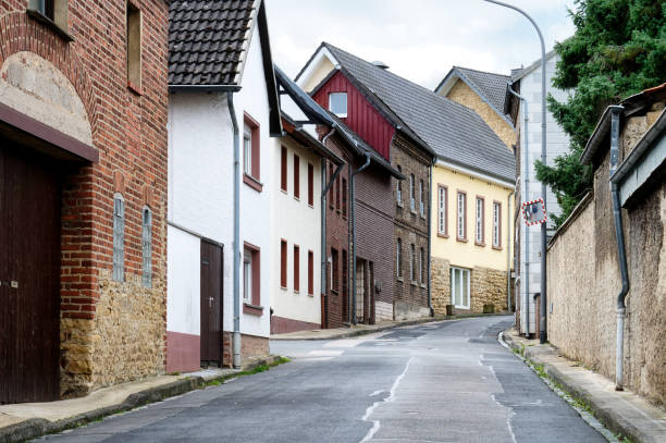 istock rural road through a small old village 1694211168