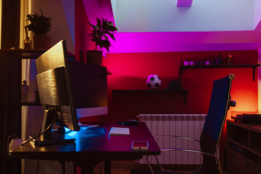 View of a gaming space at home. Neon lights, night